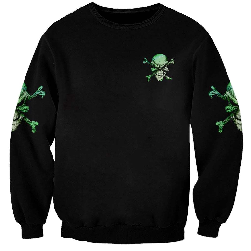 Black unisex sweatshirt with small green skull graphic on chest