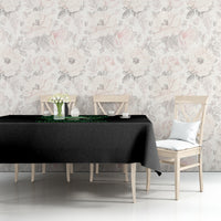 Black printed tablecloth on console table with green skull graphic and decor items.