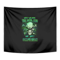 Black skull tapestry close-up with green graphic and lettering, hanging on wall.