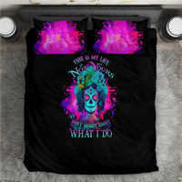 Black duvet and two purple galaxy skull printed pillowcases, top view
