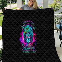 Black diamond-quilted quilt featuring a colorful neon skull and text graphic
