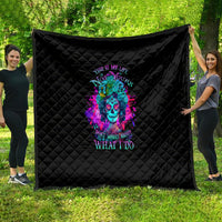 Black quilt with diamond quilting and colorful neon skull graphic in the center