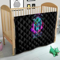 Black diamond-quilted quilt with neon skull artwork on a wooden baby bed