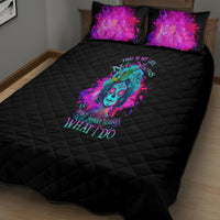 Black quilt bed set with multicolor skull graphic and matching pillow shams