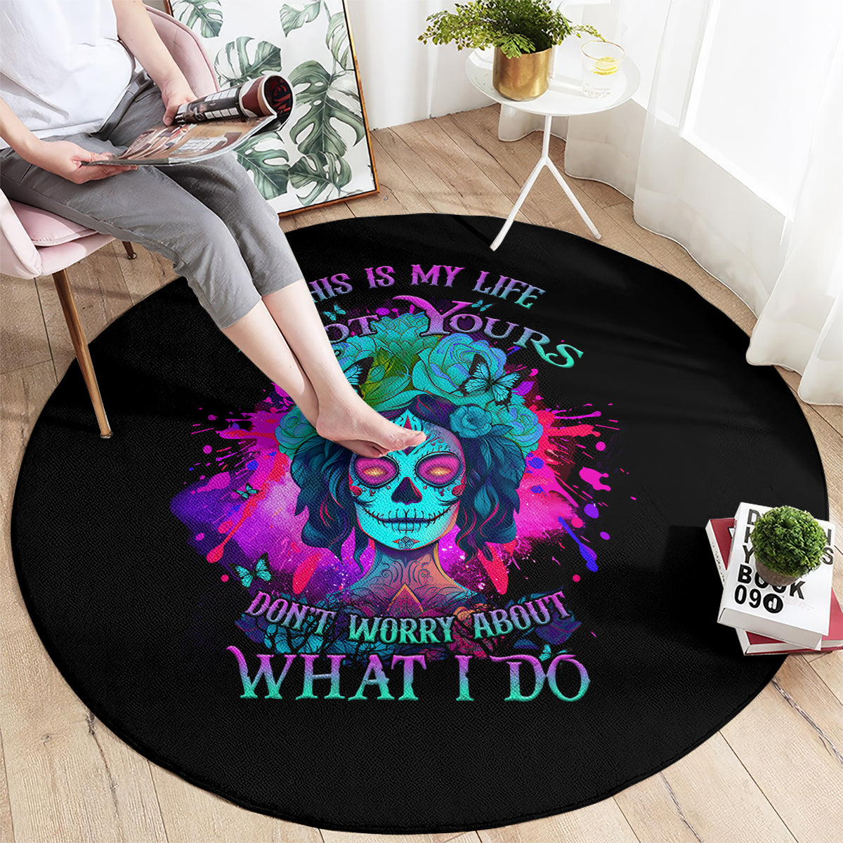 Round black carpet with colorful sugar skull and floral graphic, 'WHAT I DO' text