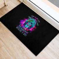 Black rubber doormat with colorful skull graphic and quote text