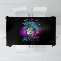 Black tablecloth with centered multicolor floral graphic and quote text