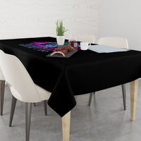 Black rectangular tablecloth with multicolor print center on a dining table