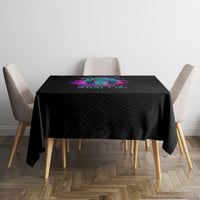 Black square tablecloth with small multicolor print centered on top
