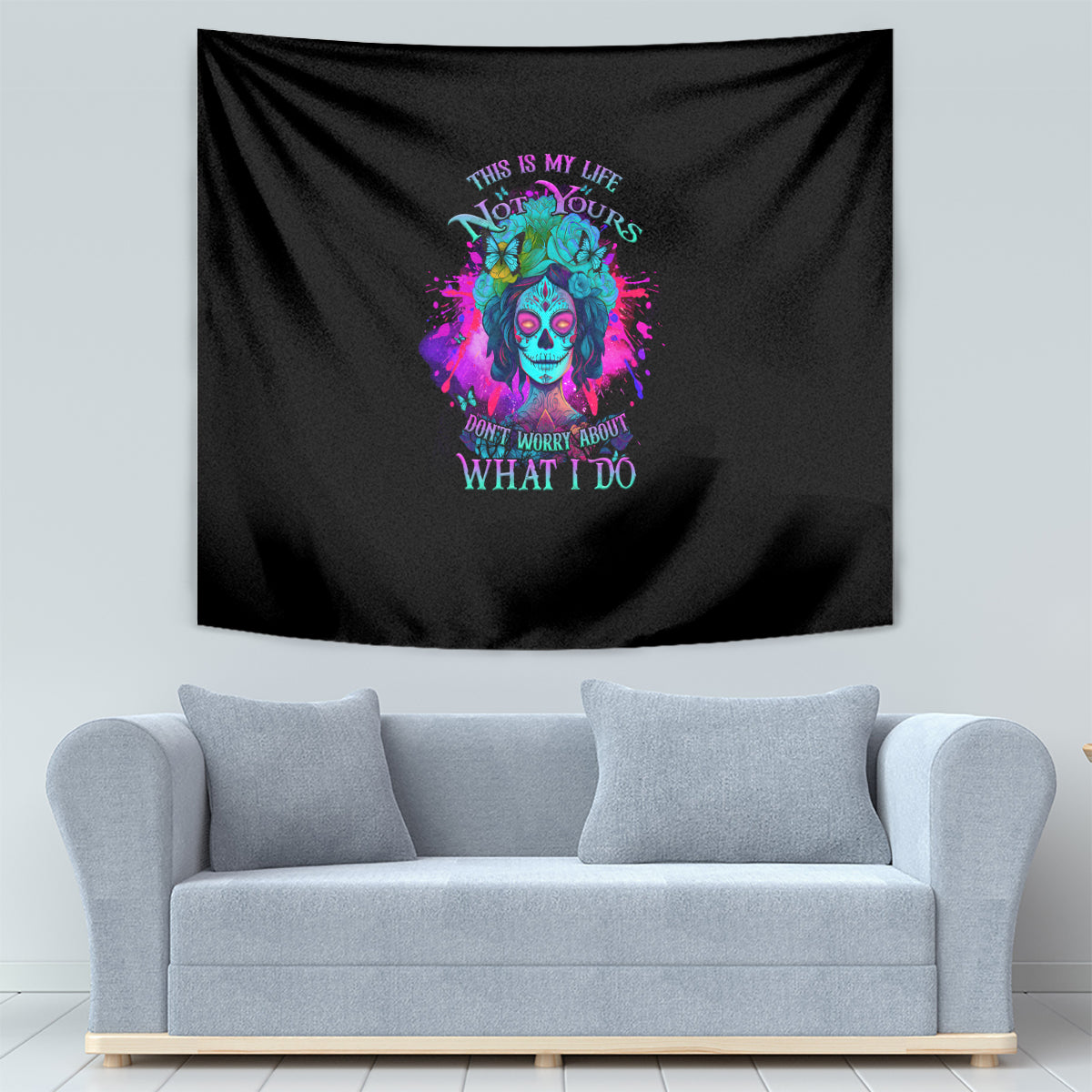 Black fabric tapestry with colorful skull portrait and decorative neon quote text