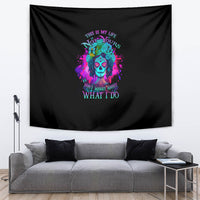 Black tapestry with vivid skull graphic, rainbow splatter accents, and quote text