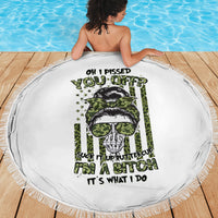 Round white beach blanket with fringed edge, green skull with sunglasses center graphic