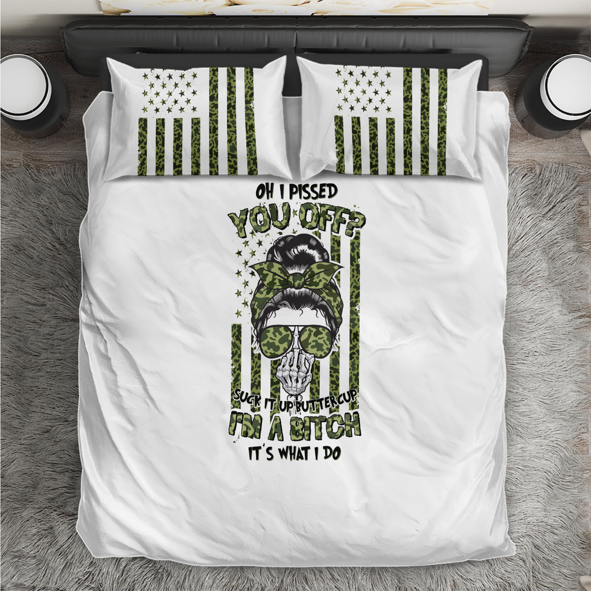 White bedding set with central green/black graphic duvet and two striped pillowcases
