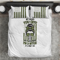White bedding set with central green/black graphic duvet and two striped pillowcases