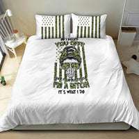 White bedding set featuring green/black graphic comforter with matching striped pillowcases