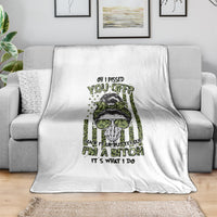 White fleece blanket with green and black skull-style graphic and bold text