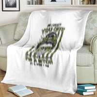White fleece blanket with large gray-and-green dripping graphic design