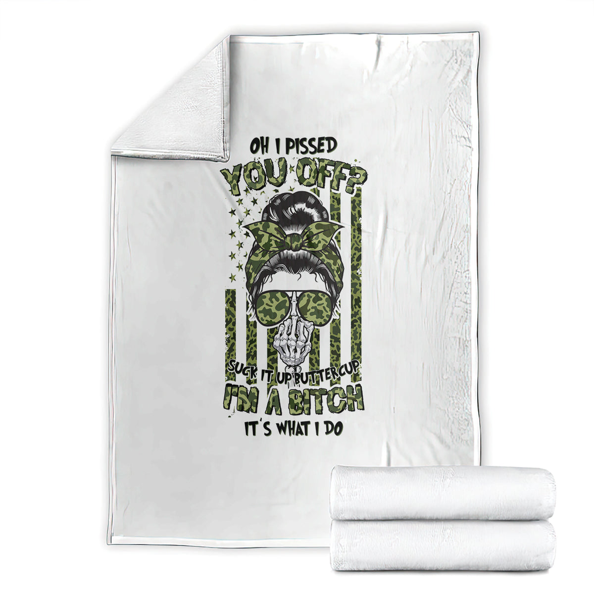 White fleece blanket folded with green-and-black skull graphic and bold text