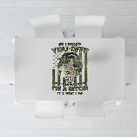 White tablecloth with centered green-and-black humorous graphic and roses print.