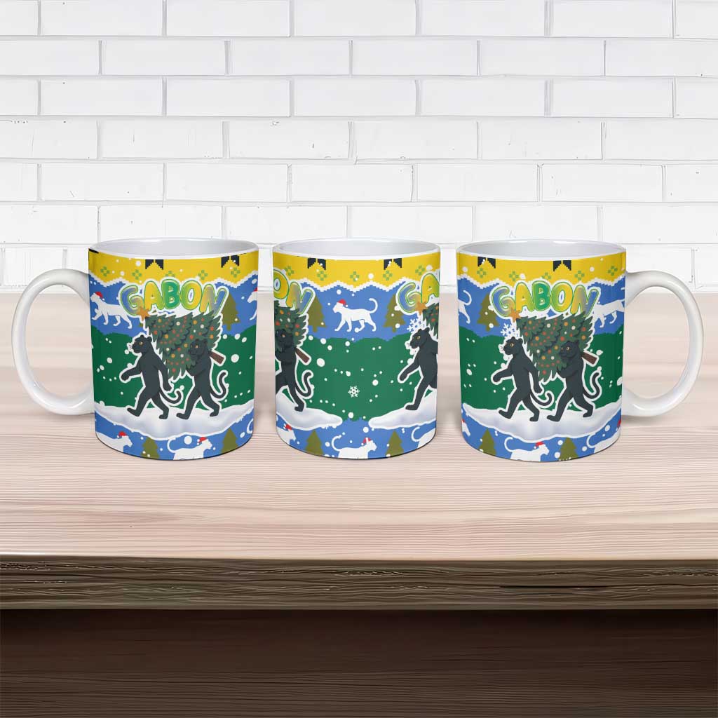 Gabon Christmas Ceramic Mug with Black Panthers Carrying Tree and Green Yellow Snowflake Pattern - Wonder Print Shop