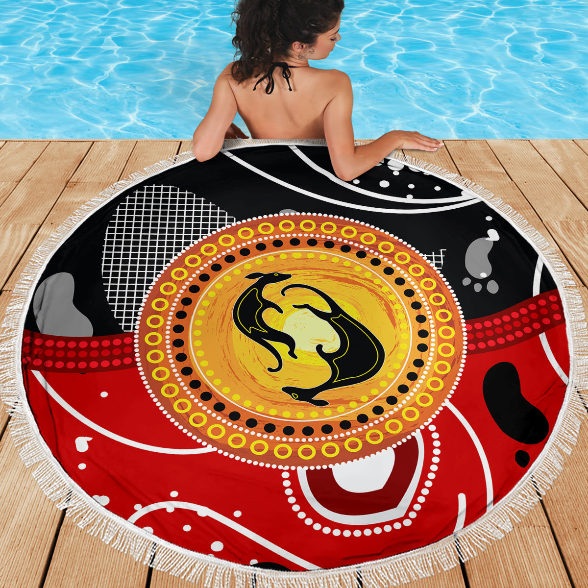 Round beach blanket with kangaroo dot art center in yellow, red accents, white fringe