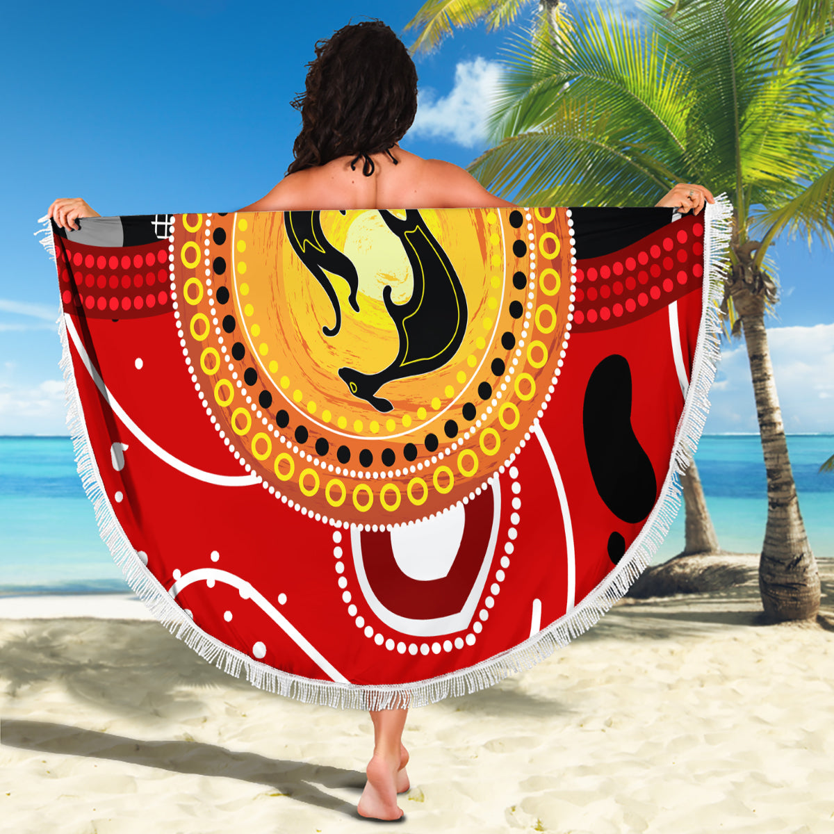 Round kangaroo beach blanket with red and black dot pattern, yellow emblem, white fringe