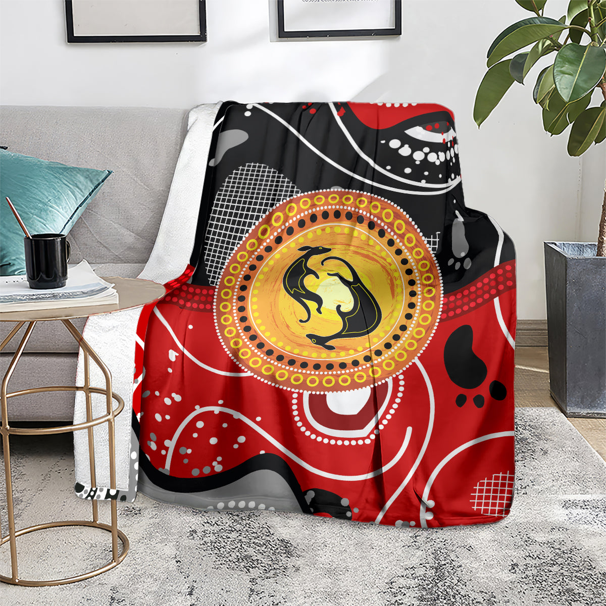 Kangaroo blanket with red, black and gray abstract dots and yellow circular emblem