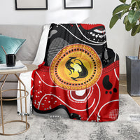 Kangaroo blanket with red, black and gray abstract dots and yellow circular emblem