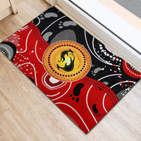 Red, black, and yellow abstract kangaroo dot-art rubber doormat, corner view