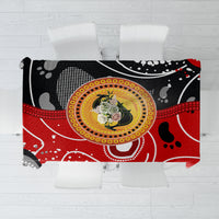 Multicolor abstract tablecloth with central round dot-art design in red, black, and white