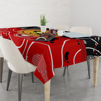 Red black white abstract tablecloth with dot pattern animal motif across the tabletop