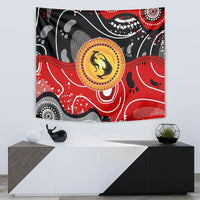 Multicolor kangaroo dot art tapestry with circular gold emblem on red and black swirls