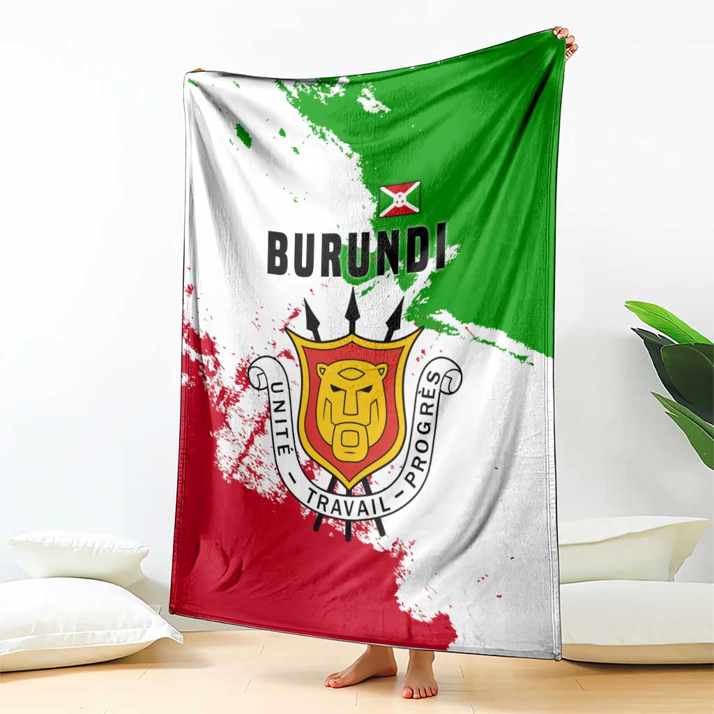 Burundi flag blanket draped over couch, featuring BURUNDI lettering and emblem