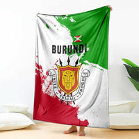 Burundi flag blanket draped over couch, featuring BURUNDI lettering and emblem