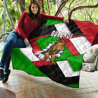 Quilt blanket showing roaring lion graphic, BURUNDI text, and green red black white diagonal stripes