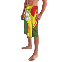 Mens lavalava sarong with red and yellow crest motif over green fabric, angled view