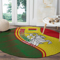 Round folk carpet with yellow crest panel, white knight on horse, green and red border