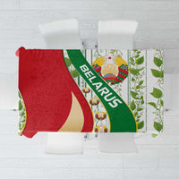 Multicolor folk tablecloth with Belarus emblem, red green gold shapes, and green leaf borders