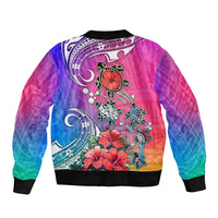 Unisex bomber jacket, back print with turtles and hibiscus on pink-blue gradient; ribbed hem.