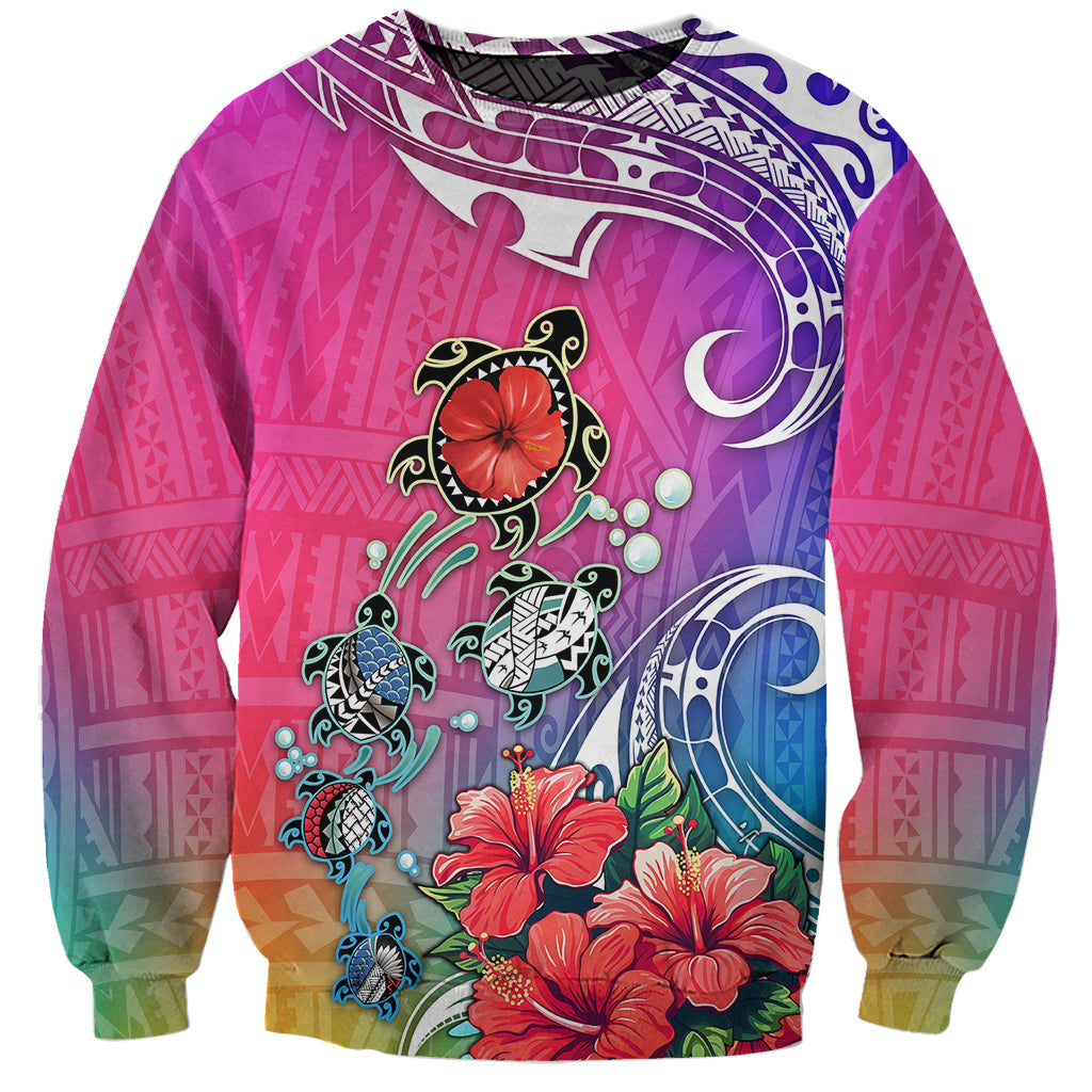 Gradient sweatshirt in purple, teal, and coral with turtle and hibiscus graphic, crewneck.