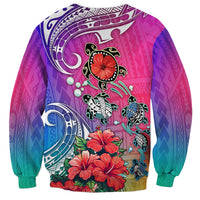 Gradient sweatshirt with turtle-and-hibiscus graphic, crewneck, purple and teal tones.