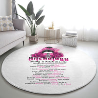 Round gray rug featuring pink skull rose artwork and bold lettering