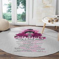 Round textured gray carpet with pink skull rose and quote lettering