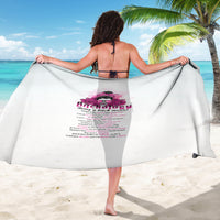 Printed beach sarong with Bitchology pink graphic and text, worn over back