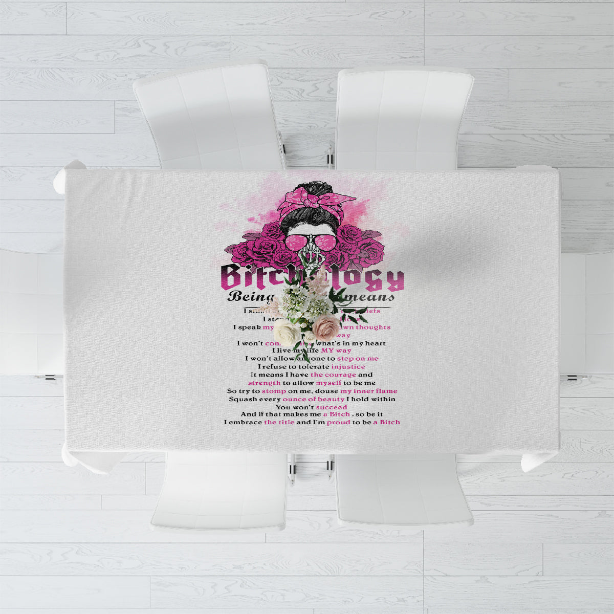 Gray tablecloth with central magenta-and-purple graphic and text design, top view