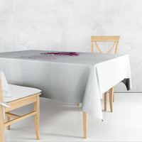 Rectangular gray tablecloth with multicolor printed message across the center