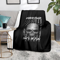 Black skull-themed throw blanket with 'UNDERSTIMATE ME' and 'THAT'LL BE FUN' lettering