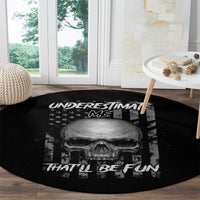 Round black carpet with skull print and 'UNDERSTIMATE ME' lettering