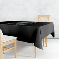 Black square tablecloth with fun skull and message graphic, draped on a table