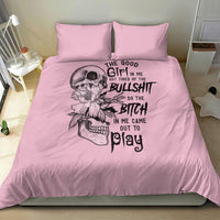 Pink duvet and two pillowcases with large skull, floral elements, and black lettering graphic